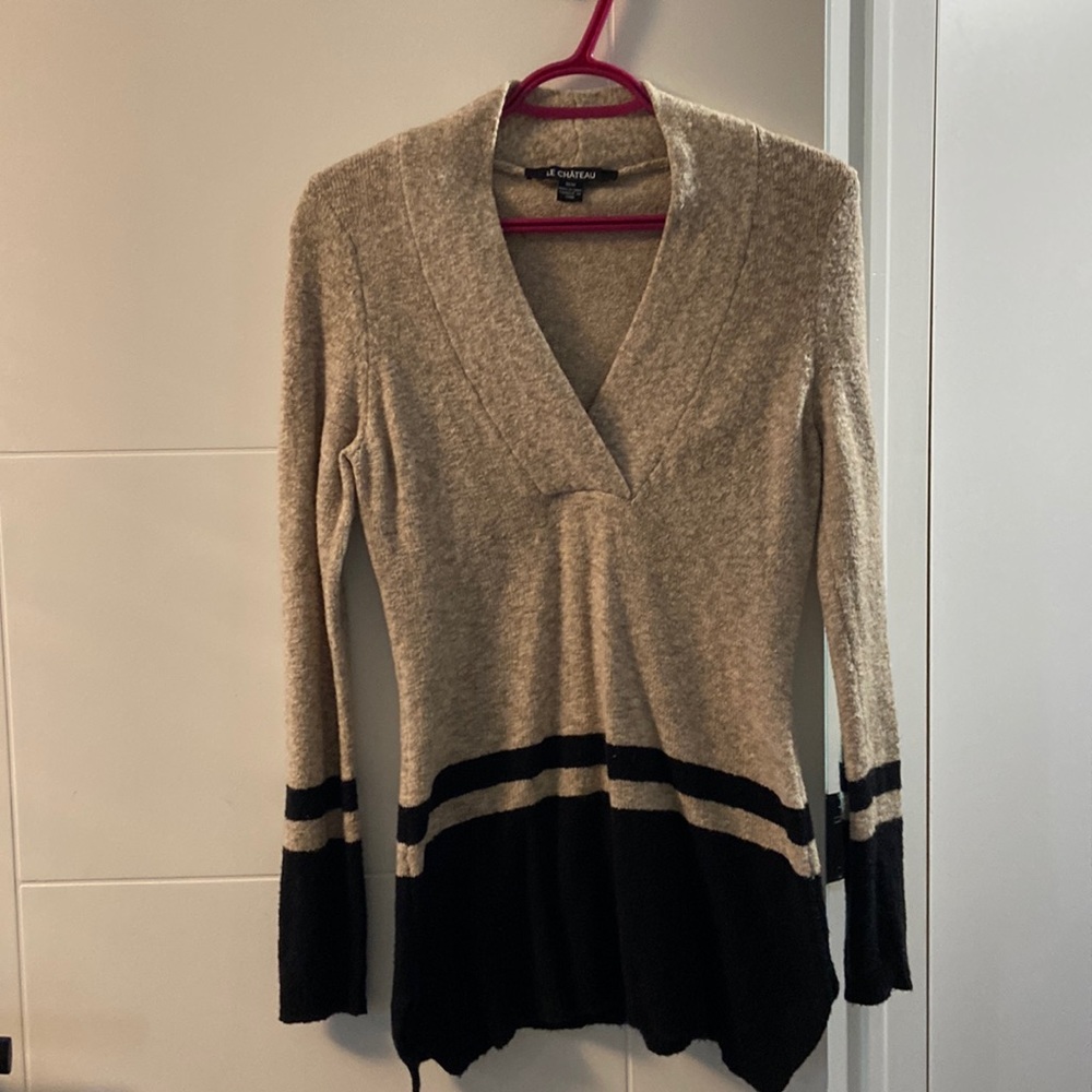 Nice long sweater never worn.